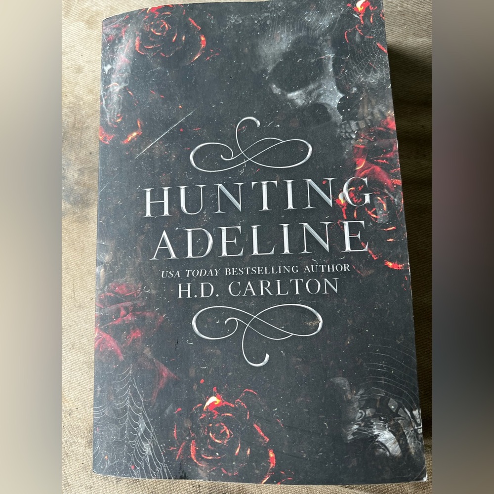 Hunting Adeline by - Black and Red Softcover Book